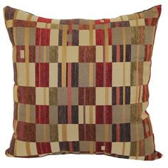 a brown and red pillow with squares on it's sides, in front of a white background