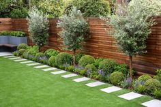 an outdoor garden with grass and trees