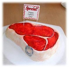 a birthday cake made to look like a piece of meat