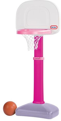 a toy basketball hoop with a ball on the ground in front of it and a plastic basket