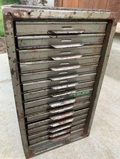 an old metal box with lots of drawers