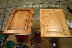 two wooden cabinets sitting next to each other on top of a table with paint and tools