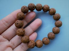 Material: natural Syagrus romanzoffiana (Natural Wood, Fragrance Free ) Size: dia. 13-14 mm round each piece Hole Side: 1.2 mm about QTY: full strand (16-17 beads) you will received Wooden Beads Rosary Bracelet For Meditation, Meditation Rosary Bracelet With Wooden Beads, Meditation Beaded Rosary Bracelet, Beaded Rosary Bracelet For Meditation, Meditation Stretch Bracelet With Round Beads, Large Beads Bracelets For Meditation, Handmade Rosary Bracelet For Meditation, Beads Mala, Mala Bracelet