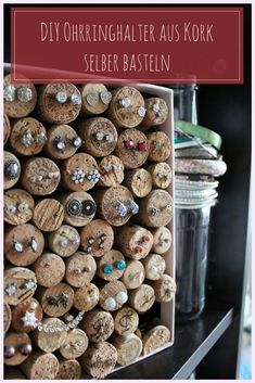 a bunch of wine corks sitting on top of a shelf