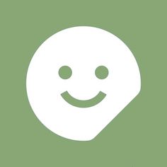 a white smiley face on a green background