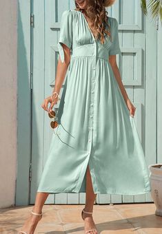 The EMES SHOP dress is detailed with fun tie sleeves. Features a v neck line. button down design. short sleeves. flowy dress. and mid-calf length. Pair it with sunnies and espadrilles for a magnificent summer look.MATERIALS: 91-99 % PolyesterMEASUREMENTS: Product length is 50"-51.9" 4-6-Small | Waist: 25-26.5 in | Chest: 33-34.5 in | Hips: 35-36.5 in 6-8-Medium | Waist: 26.5-28 in | Chest: 34.5-36 in | Hips: 36.5-38 in 8-10-Large | Waist: 28-29.5 in | Chest: 36-37.5 in | Hips: 38-39.5 in 10-12-X Summer Mid-length Dress With Button Closure, Casual Fitted Dress With Tie Sleeves, Green Summer Midi Dress With Button Closure, Trendy Short Sleeve Midi Dress For Vacation, Casual Flowy Midi Dress For Summer, Casual Summer Midi Dress With Button Closure, Summer Dresses With Button Closure, Trendy Beach Dresses With Button Closure, Summer Button Closure Midi Dress For Day Out