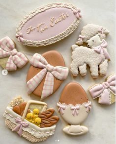 decorated cookies in the shape of baby items