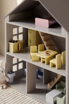 a doll house with furniture and accessories in it