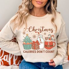 Get ready to be OBSESSED with your new favorite Christmas sweatshirt. It's the cutest and most trendy way to emit all those holiday food vibes! Because we know calories don't really count during the holidays,  right? Crafted from the softest fabric, this Gildan 18000 crewneck ensures the utmost comfort throughout the day. * Q U I C K F A C T S * ✺ 50% Cotton, 50% Polyester ✺ Wash and dry on delicate, inside out (on cool for best results) * S I Z I N G * ✺ Models are wearing size Large ✺ Sizing i Christmas Movie Shirts, Cheer Shirt, Santa Sweatshirt, Christmas Jesus, Pink Out, Spirit Shirts, Faith Shirt, Christian Christmas, Movie Shirts