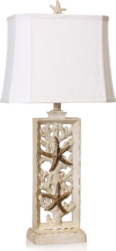 a white lamp with a starfish on it