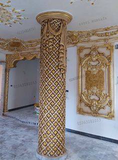 an ornately decorated column in the middle of a room