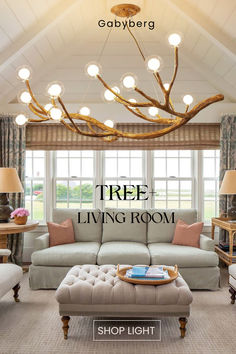 a living room filled with furniture and lamps on top of the ceiling next to a window