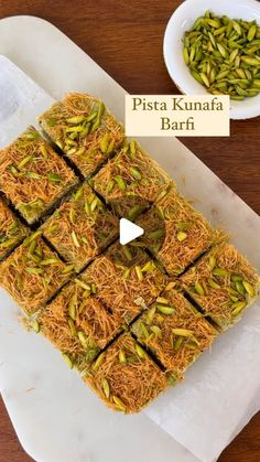 pistaa kunafa barf is cut into squares on a cutting board