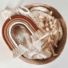 a basket filled with lots of different types of cloth