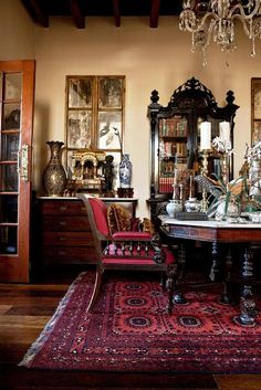 an ornate dining room with chandelier and antique furniture