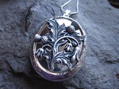 "Beautiful locket choose from silver plated or gold plated. Scotland's national emblem since the 1400's. The thistle has amazing details and is professionally plated and oxidized, to enhance the quality, and completely lead and nickel free. The locket is Victorian style with beautiful etching on both the front and back 2\" long, please see the photos for size. It can hold two photos, keepsakes, or even your daily medication or vitamins. Pass down from generation to generation. The chain is a mat Antique Polished Jewelry For Weddings, Victorian Jewelry For Wedding With Polished Finish, Traditional Ceremonial Jewelry With Engraving Option, Victorian Polished Jewelry For Weddings, Victorian Style Polished Jewelry For Wedding, Victorian Wedding Jewelry With Polished Finish, Ornate Silver Jewelry With Engraving Option, Victorian Jewelry With Polished Finish For Ceremonial Occasions, Classic Silver Ceremonial Necklace