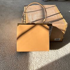 This Caramel Brown, Calf Leather Bag Is New, Never Used. No Issues Other Than Unnoticed Scratches To The Leather And Hardware Due To Their Nature. Great Piece For The Upcoming Season And Can Be Worn Dressed Up Or Down As A Shoulder Or Handheld/Arm Crook Bag. Very Classy Piece That Is Capable Of Making A Unique, Edgy Statement! Dust Bag And Box Received Included. Mansur Gavriel Bucket Bag, Mansur Gavriel Bag, Black Bucket Bag, Cloud Bag, Mini Bucket Bags, Elegant Bags, Leather Box, Caramel Brown, Mansur Gavriel