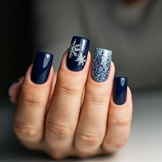 Frosty nails for a fabulous winter! Transform your look with these 12 stunning winter nail design ideas that are trending in 2024. From cool tones to glimmering finishes, these designs add a touch of elegance to your winter wardrobe. Show off your unique style with every gesture! #WinterNailArt #NailDesign #TrendyNails #NailInspo #WinterNails #NailTrends2024 #ChicNails #NailGoals #HolidayNailArt #NailInspiration Dark Blue With Snowflakes Nails, Winter Blue Snowflake Nails, Dark Blue Sweater Nails, Iridescent Snowflake Nails, Dark Winter Nails With Design, Dark Blue Nails Christmas, Dark Blue Winter Nail Designs, Christmas Nails Simple Blue, Multi Colored Blue Nails