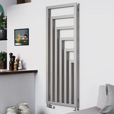 a white radiator mounted to the side of a wall