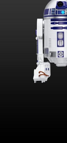 a star wars r2d2 robot is shown in the dark