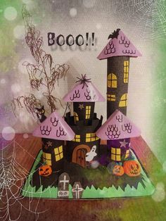 a halloween card with a castle made out of paper