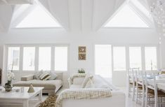 a living room filled with furniture and white walls