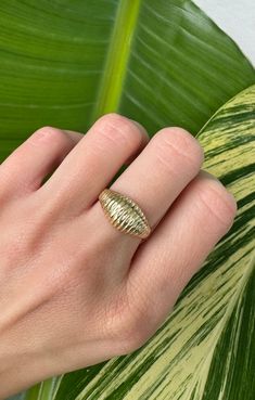 Vintage 14k Solid Gold Dome/ Shrimp Ring Description: This vintage 14k solid gold dome ring, also known as a shrimp ring, features detailed ridges on top. Weighing 3.5 grams and sized at 6 (sizable), this ring is a unique and stylish addition to any jewelry collection. This piece, like all our jewelry, is a rare find—once it's gone, it's gone. Choosing this piece is a win-win: You'll stand out from the crowd and help the environment by shopping sustainably! Why You'll Love It: Bold Design: The dome shape and detailed ridges make a bold statement. Versatile Fit: The ring is sizable, allowing for a perfect fit. Rare and Exclusive: Our pieces are often one-of-a-kind. Don’t miss this exclusive item. Details: Material: 14k Solid Gold Weight: 3.5 grams Size: 6 (sizable) Style: Bold, Unique Perfe Heirloom 14k Gold Dome Ring Tarnish Resistant, Vintage 14k Gold Domed Dome Ring, Oval 14k Gold Dome Ring, Heirloom Dome Ring With Tarnish Resistance, Vintage 14k Gold Dome Ring, Tarnish Resistant, Vintage 14k Gold Dome Ring Tarnish Resistant, Vintage 14k Gold Tarnish-resistant Dome Ring, Yellow Gold Domed Ring Stamped 14k, Heirloom 14k Gold Dome Ring