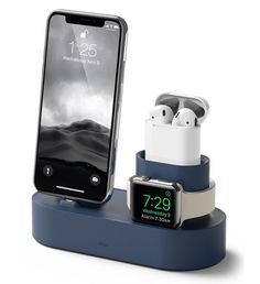 an apple watch and earphones are on display in this charging station for the iphone