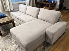 a sectional couch in the middle of a living room