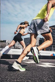 two people are running on the street