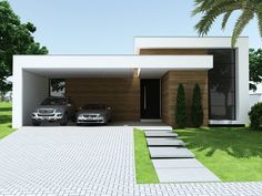 two cars parked in front of a modern house