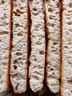 several slices of bread are lined up on a plate