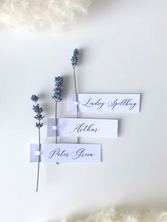 three place cards with lavender flowers on them