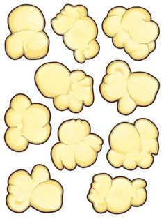 a bunch of yellow popcorn kernels on a white background