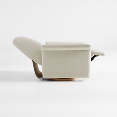 a white reclining chair sitting on top of a wooden base