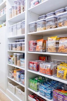 an organized pantry filled with lots of food and containers on shelves next to each other