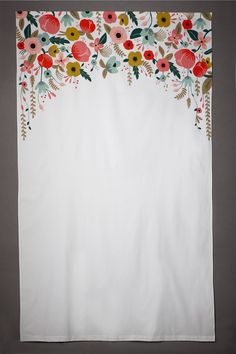 the screen is displaying an image of a white curtain with colorful flowers on it,