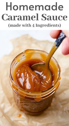 homemade caramel sauce in a small glass jar with a spoon sticking out of it