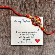 a card with a red string attached to it that says, to my brother i am sending you my love in this card along with the fabric that will protect you from all evil