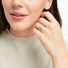 a close up of a person wearing a ring