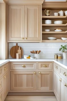 a kitchen with wooden cabinets and white counter tops