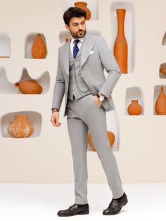 This grey 3-piece slim-fit suit is the epitome of sophistication and style. The jacket features wide lapels, creating a bold statement and showcasing a keen eye for detail. The vest, with its matching lapels, further elevates the aesthetic and provides a cohesive look. Upgrade your wardrobe with this standout piece and make a lasting impression at your next event. Color: grey Material: 60% wool, 30% polyester, 7 viscose, 3% elastane Suit includes blazer, waistcoat, & trousers Single-breasted sui Blazer Waistcoat, Grey Slim Fit Suit, Vest Suit, Suit For Men, Lapel Jacket, Slim Fit Suit, Men's Suit, 3 Piece Suits, Grey Material