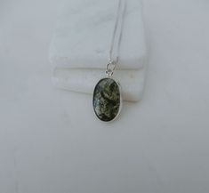 "Moss agate pendant set in solid .925 sterling silver. Moss agate has a unique moss like look in a clearish or whitish stone it has a unique translucence with green moss like areas, or mosslike inclusions that are actually minerals, not moss. you will not find this rare gemstone very often! The moss agate stone has been set into solid sterling silver. The pendant is hanging on a sterling silver chain of your choice. It is difficult to capture the real uniqueness of this stone with a camera. Item Moss Agate Necklace, Moss Agate Stone, Rare Gemstones, Necklace Gemstone, Agate Necklace, Agate Pendant, Necklace Sterling Silver, Agate Stone, Moss Agate