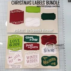 christmas labels and stickers for sale on a cutting board