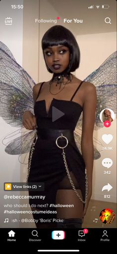 a woman in a black dress with wings on her head and the caption below