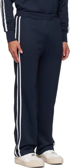 AMI Paris.SSENSE Exclusive Navy Track Pants.Nylon- and cotton-blend French terry track pants..· Concealed drawstring at elasticized waistband.· Three-pocket styling.· Stripes at outseams.· Embroidered logo patch at back pocket.Available exclusively at SSENSE..Supplier color: Lazuli blue.60% polyamide, 40% cotton..Made in Bulgaria..231482M190009 Cotton Sweatpants With Side Stripes In Straight Leg, Cotton Straight Leg Sweatpants With Side Stripes, Cotton Sweatpants With Side Stripes, Ami Menswear, Blue Track Pants, Navy Track Pants, Ami Paris Blue Sweater, Men’s Track Pants, Personal Shopping