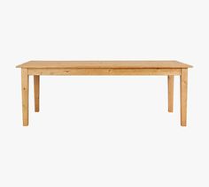 a wooden table sitting on top of a white wall