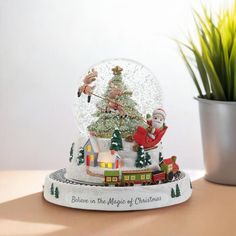 there is a snow globe with santa claus on it