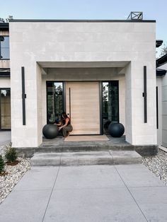 Modern entry, porch inspo, crate and barrel, planter Crate And Barrel Sphere Planter, Modern Front Door Lighting, Modern Front Entrance Exterior Design, Modern Portico Entrance, Entrance Outdoor Design, Metal House Exterior, Modern Front Door Entrance, Modern House Front Door, Modern Front Entrance