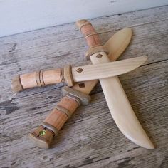 a wooden toy with four pieces of wood attached to it